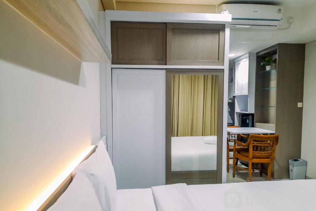 Cozy Studio Room at Patraland Amarta Apartment By Travelio photo 2