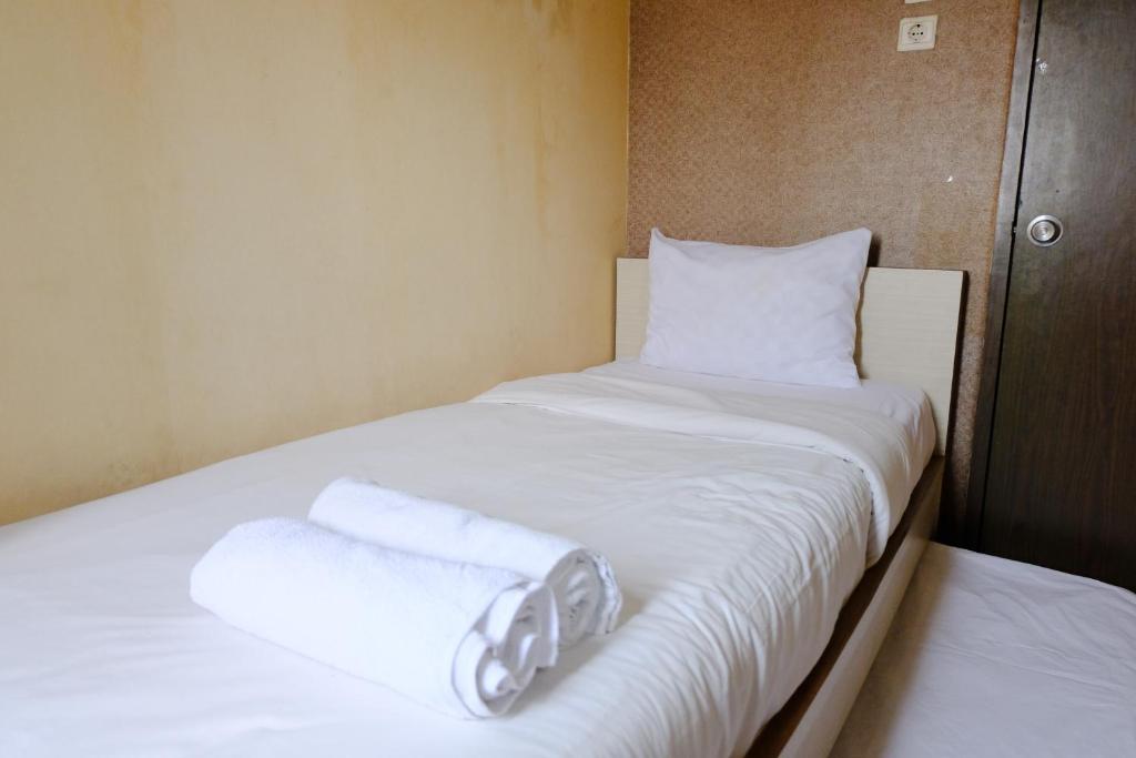 Cozy 2BR Apartment at Suites @ Metro By Travelio