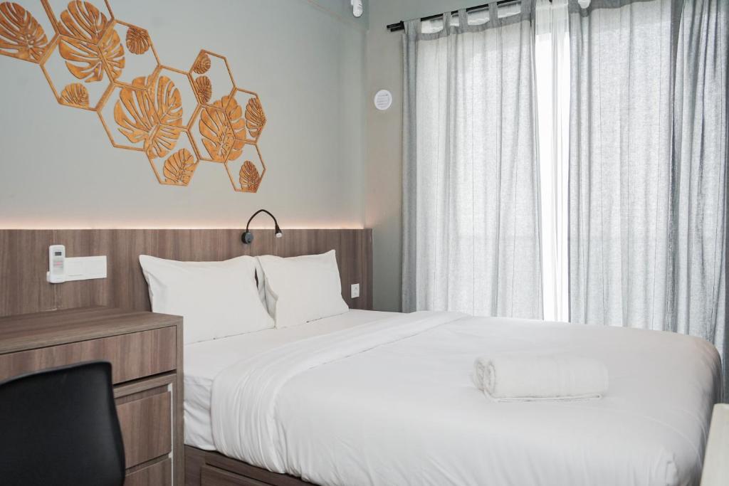 Good Designed and Cozy Studio at Sky House BSD Apartment By Travelio