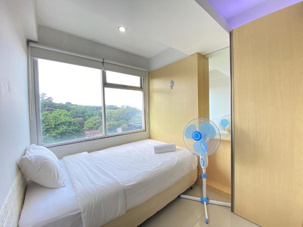Comfortable 2BR Apartment AC in Living Room at The Jarrdin Cihampelas By Travelio