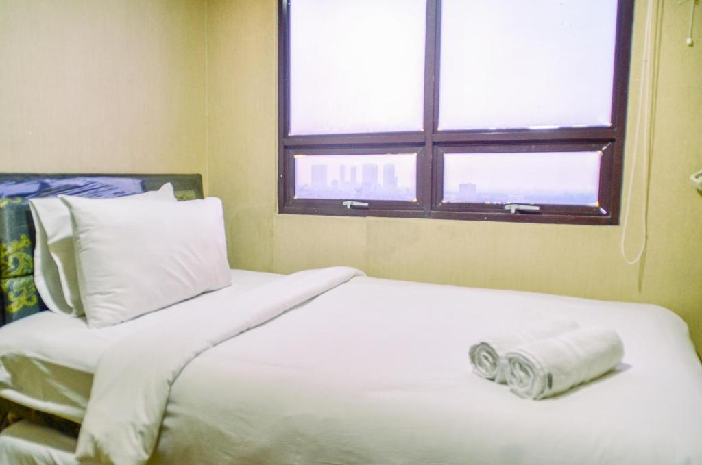 Nice and Cozy 2BR Apartment at Atria Residence Gading Serpong By Travelio