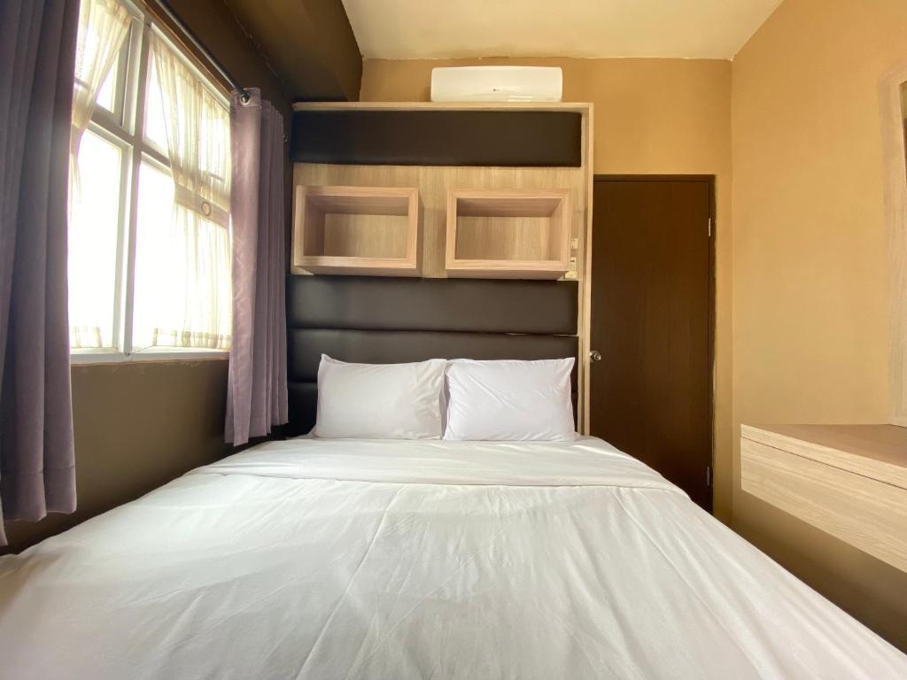 Well Furnished 2BR at Suites @Metro Apartment By Travelio