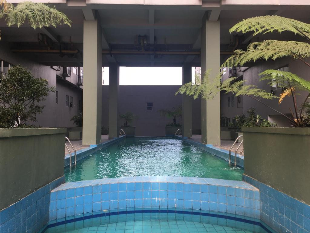 Comfy 2BR Apartment at Grand Asia Afrika By Travelio