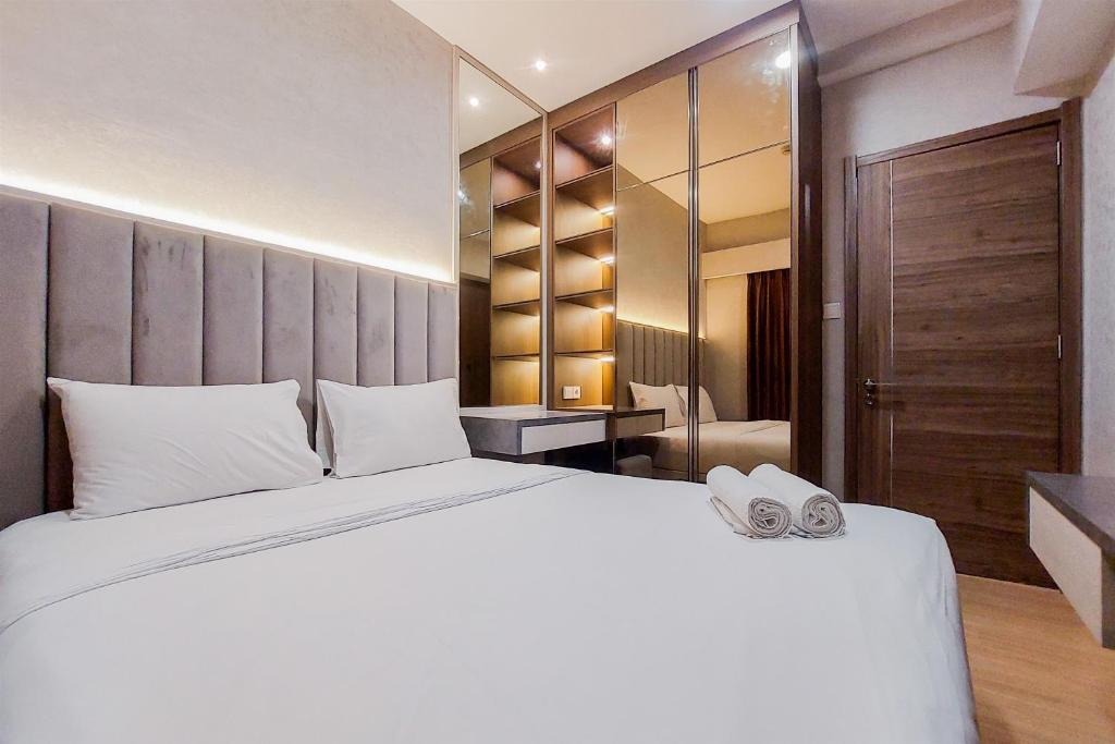 Spacious and Nice 2BR at Sky House BSD Apartment By Travelio