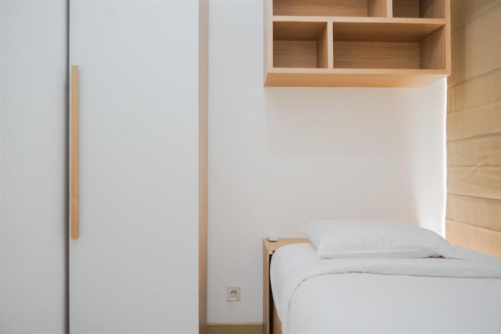 Nice and Comfy 2BR Apartment at M-Town Residence near Summarecon By Travelio