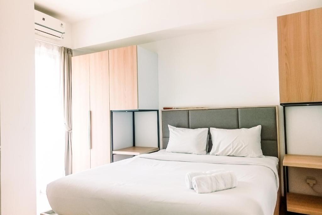 Cozy and Elegant with Pool View 2BR Apartment at M-Town Residence By Travelio