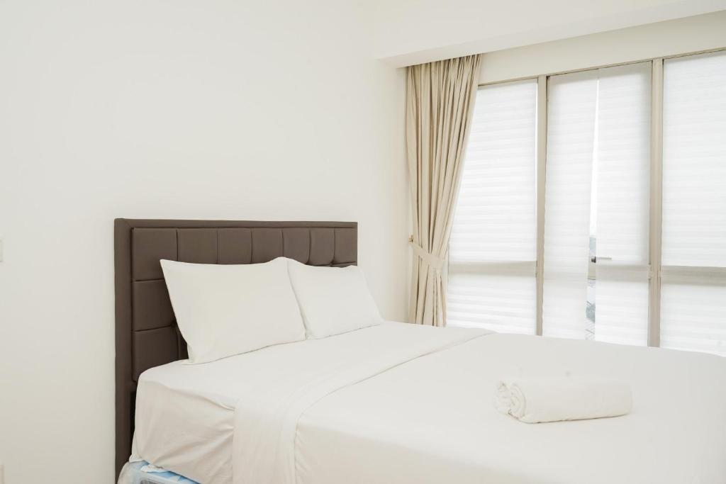 Homey and Comfy 1BR at M-Town Signature Apartment By Travelio