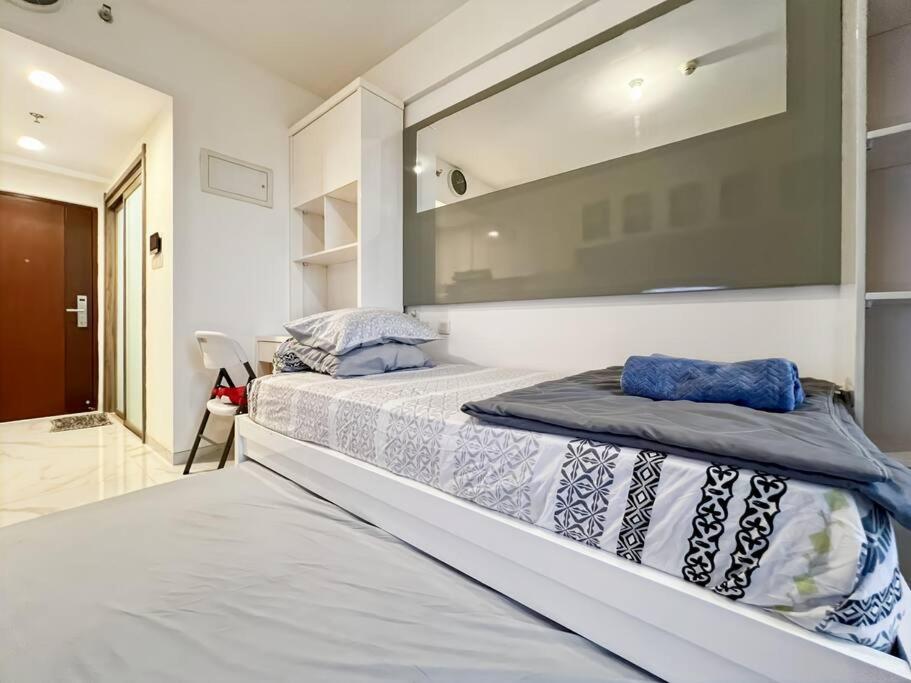 Cozy Studio Skyhouse Apt near ICE BSD with pool & Gym by 2ndHome photo 4