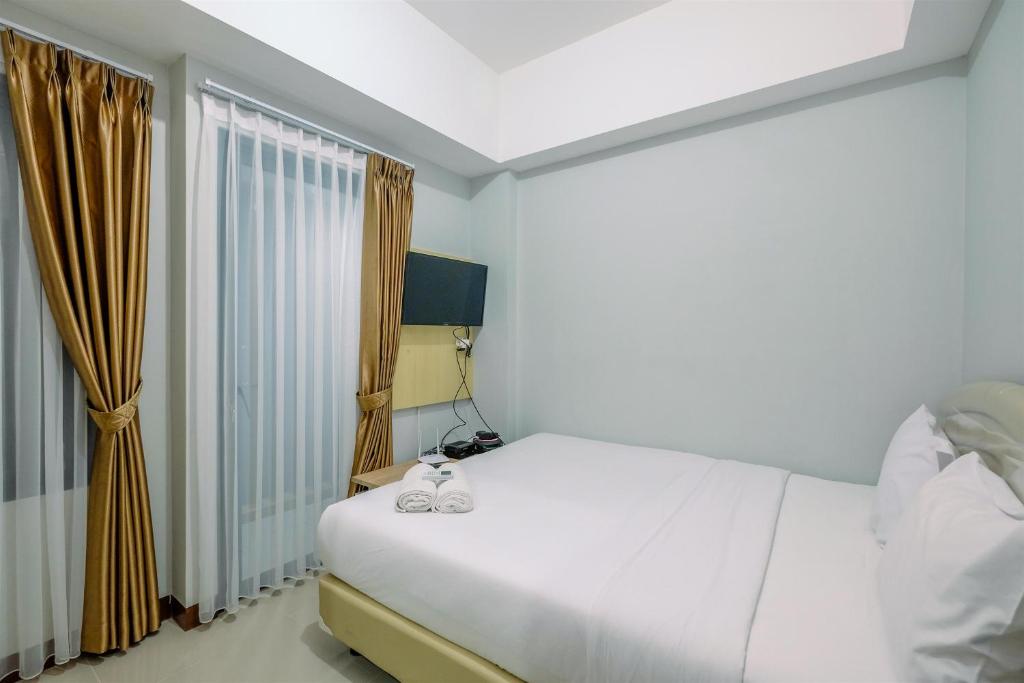 Nice and Elegant 1BR at Royal Heights Apartment By Travelio photo 1