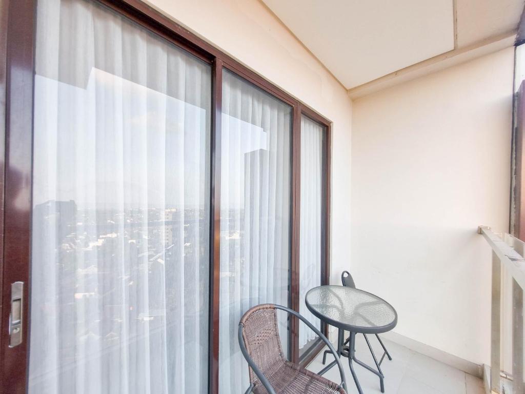 Elegant and Spacious 1BR at Patraland Amarta Apartment By Travelio photo 4