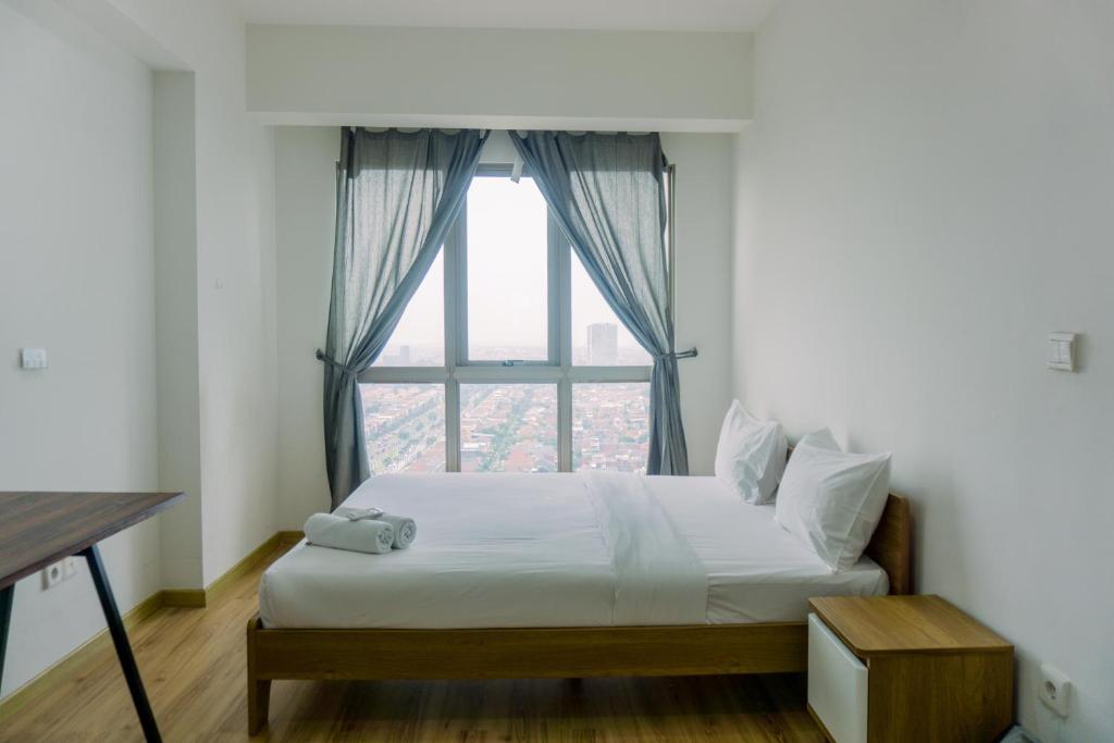 Cozy Stay 1BR at M-Town Signature Apartment By Travelio, Tangerang