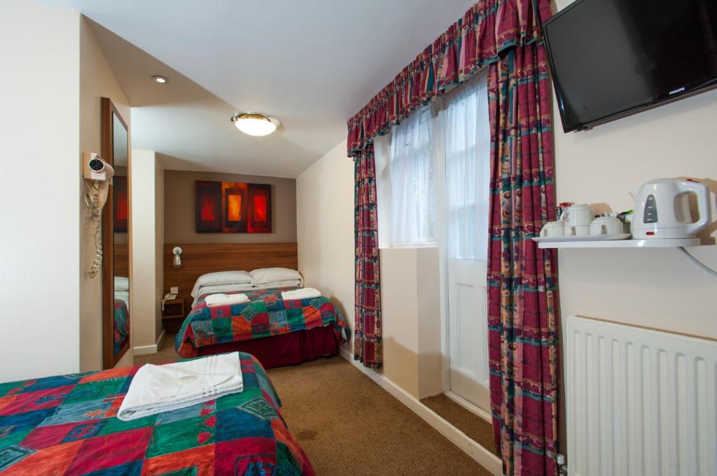 Dover Hotel London - Tap to explore photos