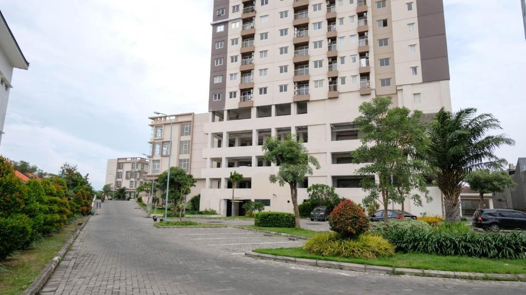 Cozy Living and Tidy 2BR at Puncak Dharmahusada Apartment By Travelio