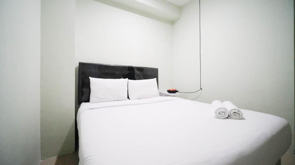 Best Location and Comfy 2BR at Bale Hinggil Apartment By Travelio, Surabaya