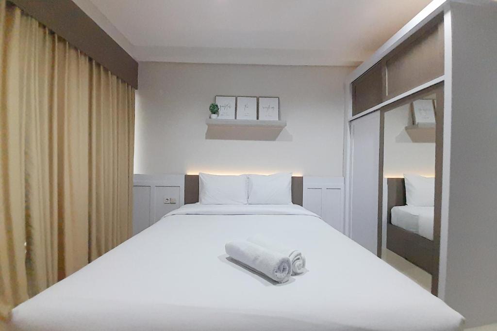 Cozy Studio Room at Patraland Amarta Apartment By Travelio photo 3