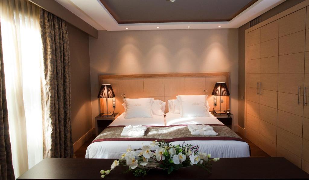 Nexus Valladolid Suites & Hotel - Tap to explore photos