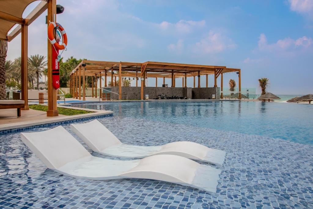 Dusit Ajman Resort & Villas - Tap to explore photos