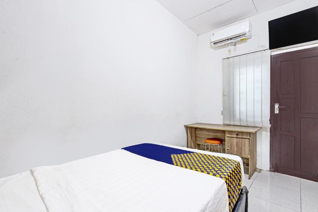SPOT ON 91521 Mayong Guesthouse - Tap to explore photos