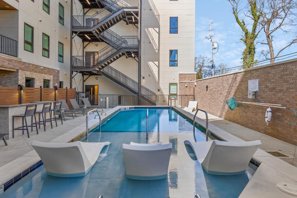 Chic Music Row Condo Rooftop Deck with City View Gym Office and More
