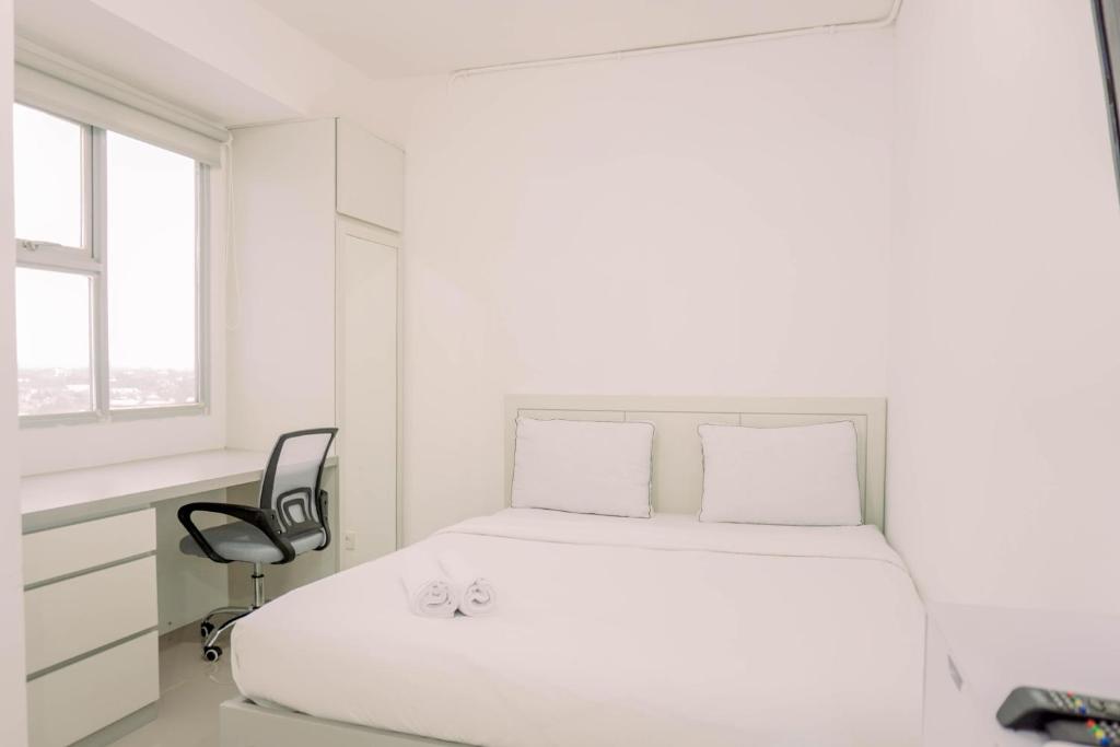 Cozy Stay Studio at Urbantown Serpong Apartment By Travelio