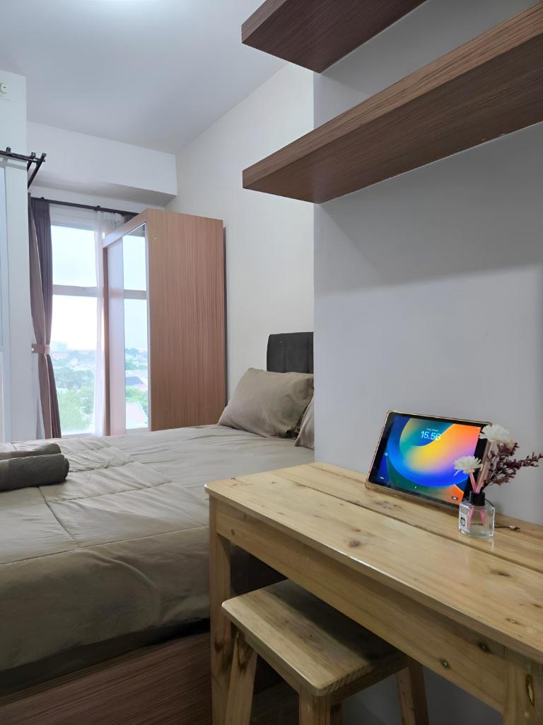 Apartemen amazana cozy, wifi, gym, pool photo 1