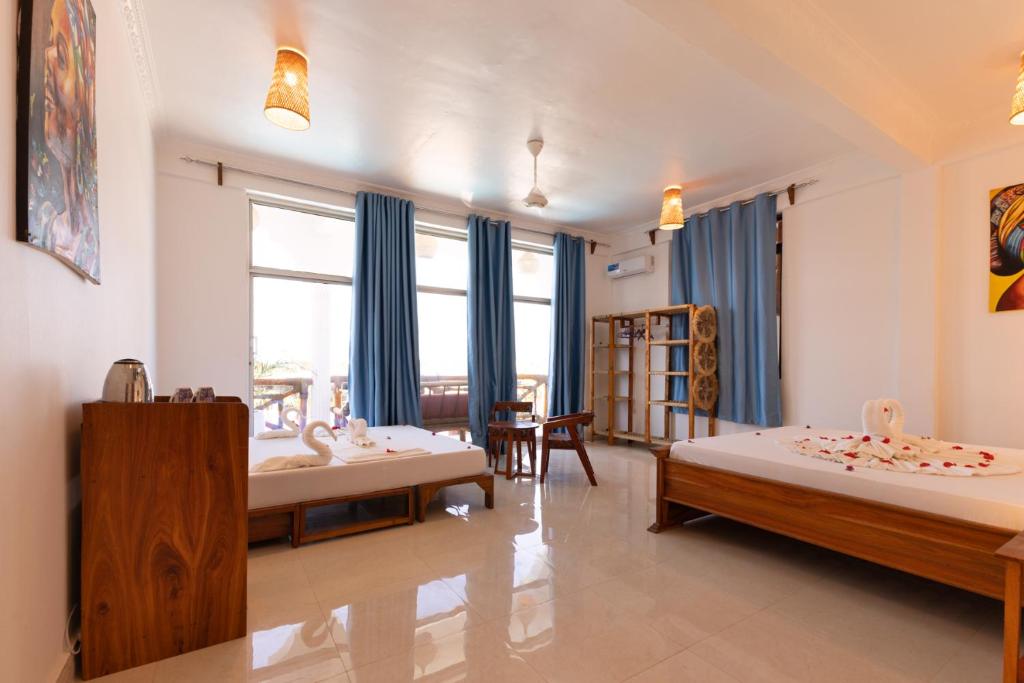 Diacarisma Boutique Resort Nungwi Room Type - Deluxe Quadruple Room