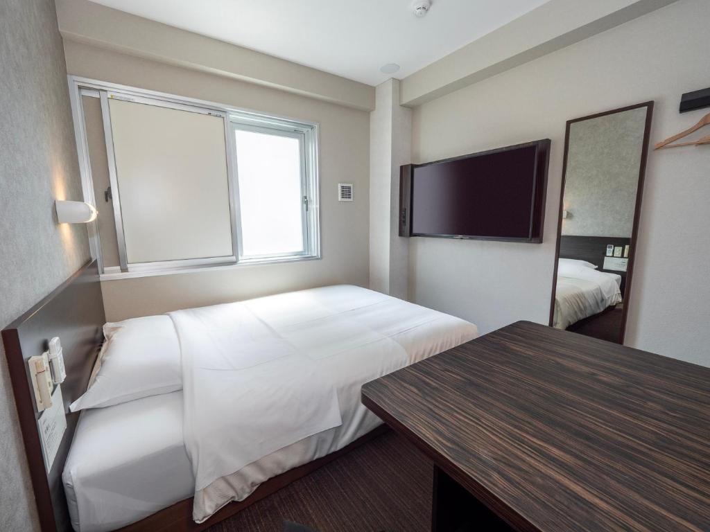 Super Hotel JR Shin-Osaka Higashiguchi - Tap to explore photos
