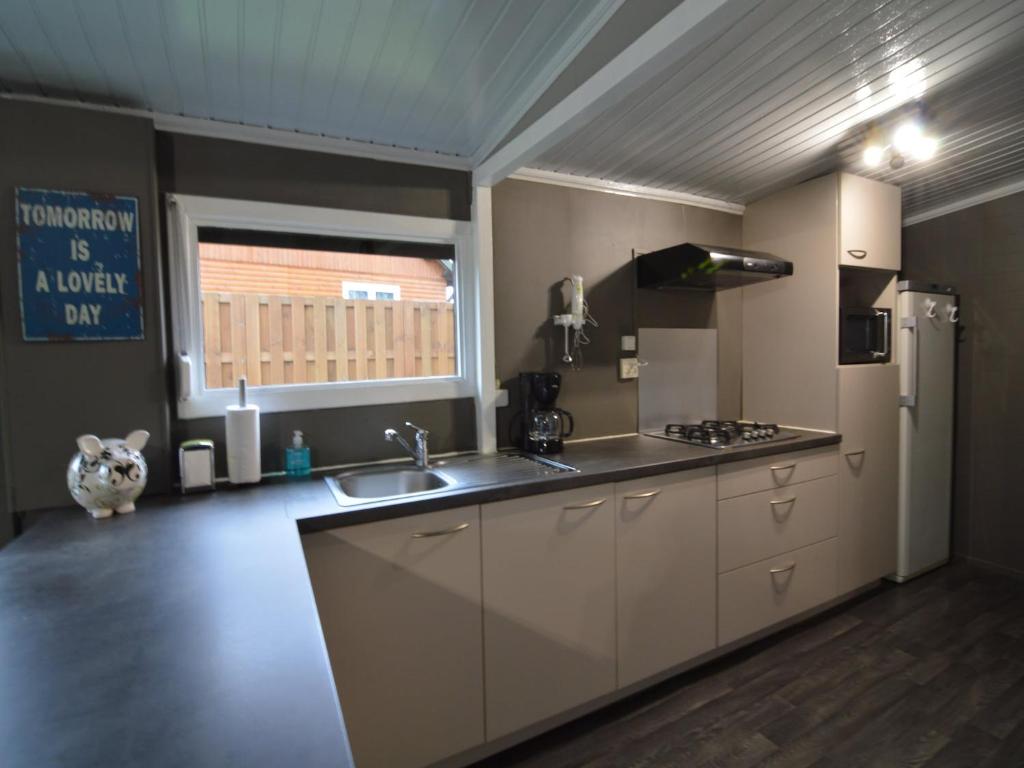 Modern chalet in a small park with a fishing pond photo 2