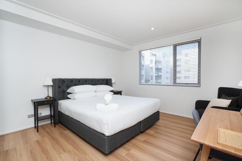 Modern 1-Bed Unit with Pool Views and Balcony - Tap to explore photos