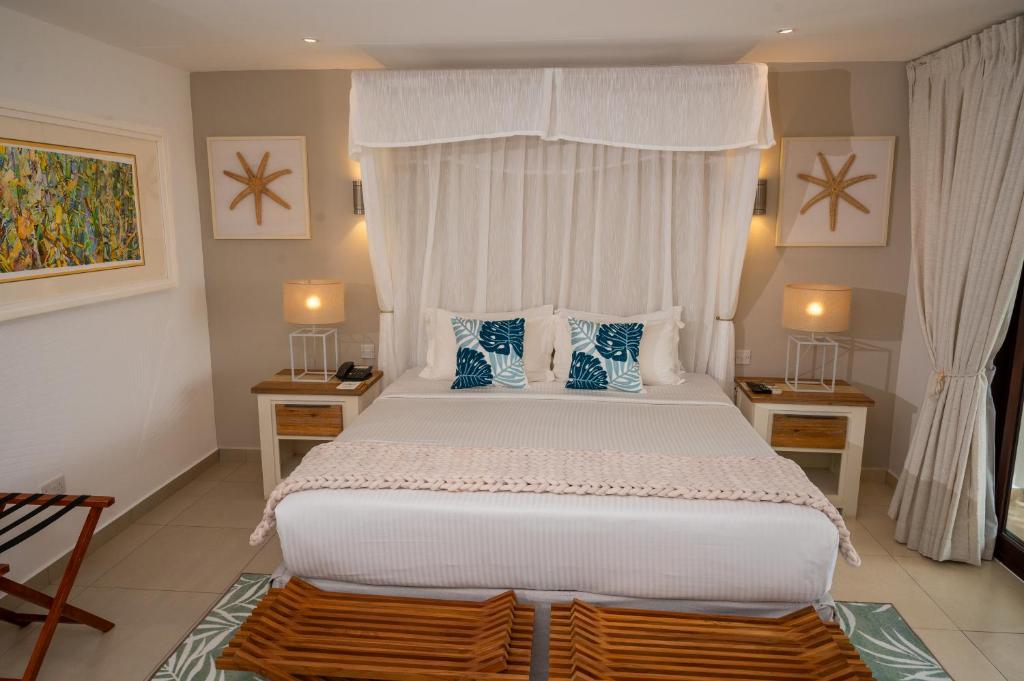 Acajou Beach Resort - Tap to explore photos