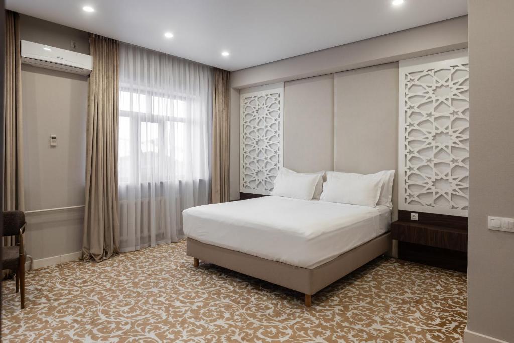 Boutique Hotel Tomiris - Tap to explore photos