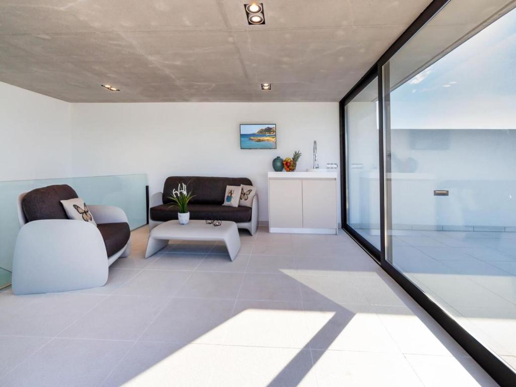 Villa in Búger with Rooftop Pool & Scenic Views - Tap to explore photos