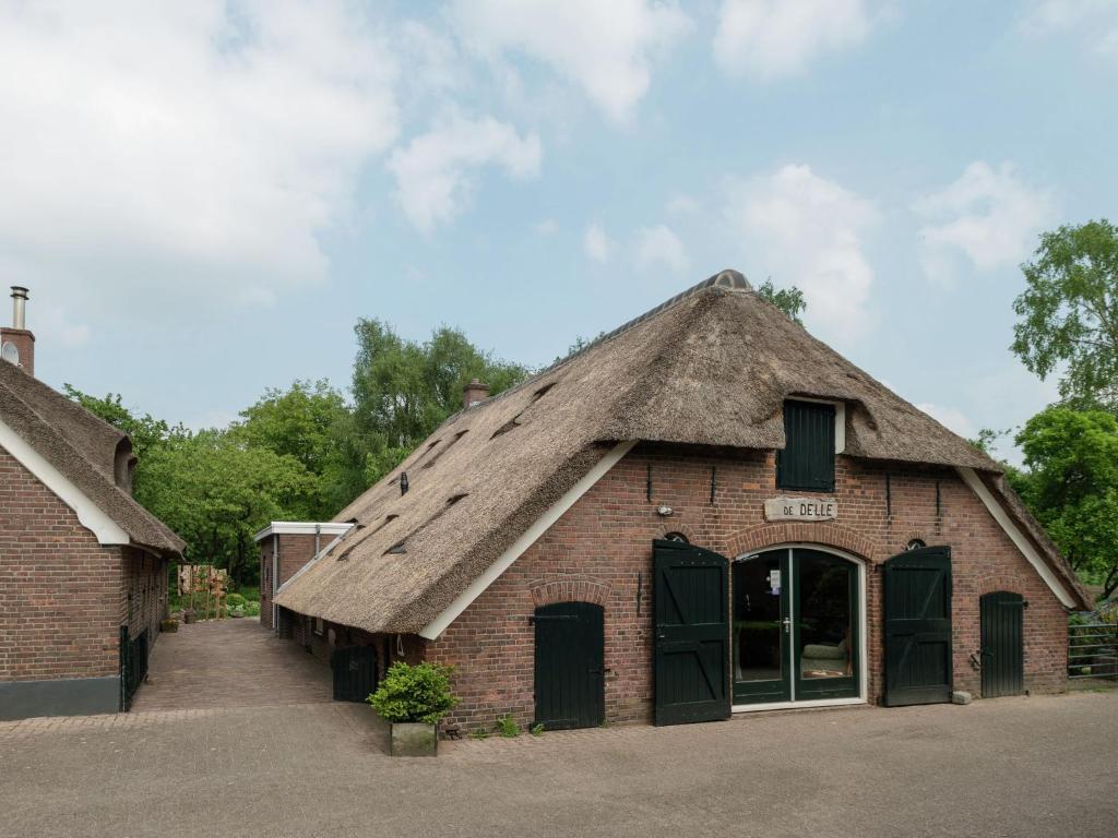 Attractive holiday home with a wood stove, located on a farm