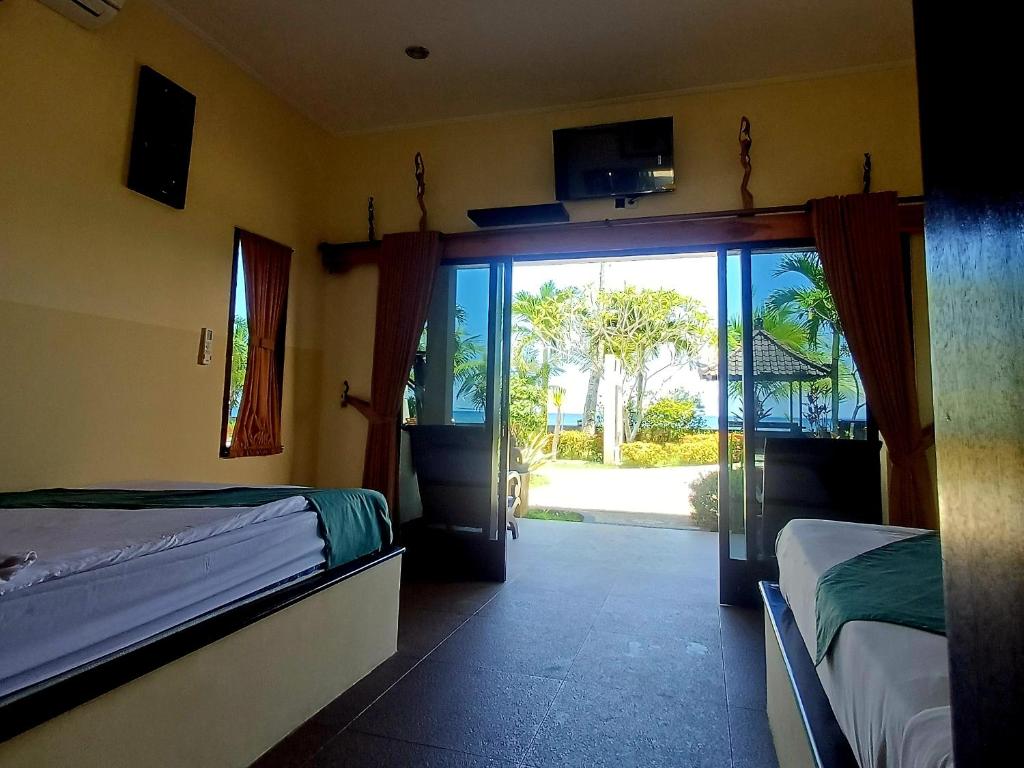 Melaya beach resort Twin bed - Tap to explore photos