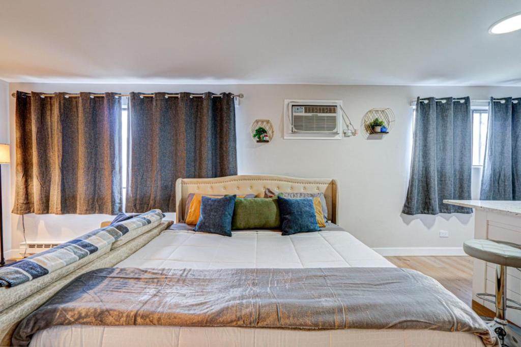 Luxury King Bed • Remodeled Safe Chicago Condo - Tap to explore photos