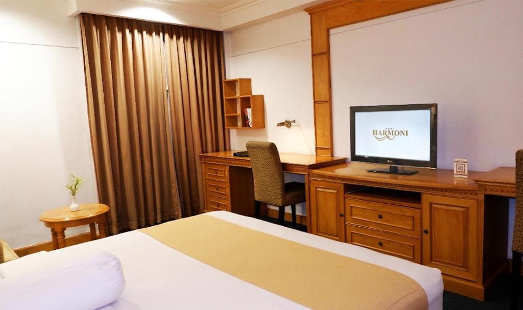 Harmoni Suites Hotel - Tap to explore photos