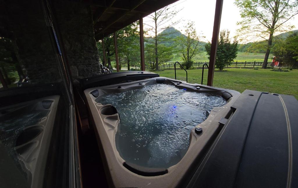 A-Frame Getaway with Hot tub, Sauna, Fire Pit & Pond - Station Camp Getaway - Tap to explore photos