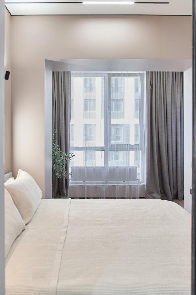 DM Aparts - Комфорт Сити Business Apartments - Tap to explore photos