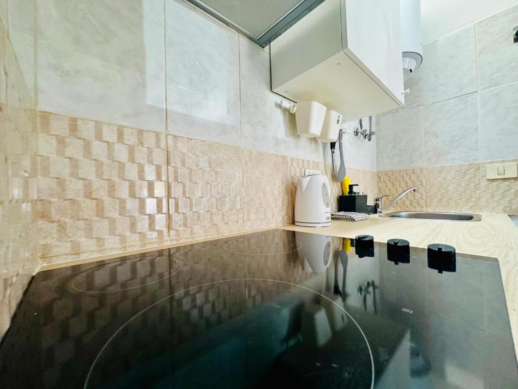 Sunny studio with private terrace pool access - Tap to explore photos