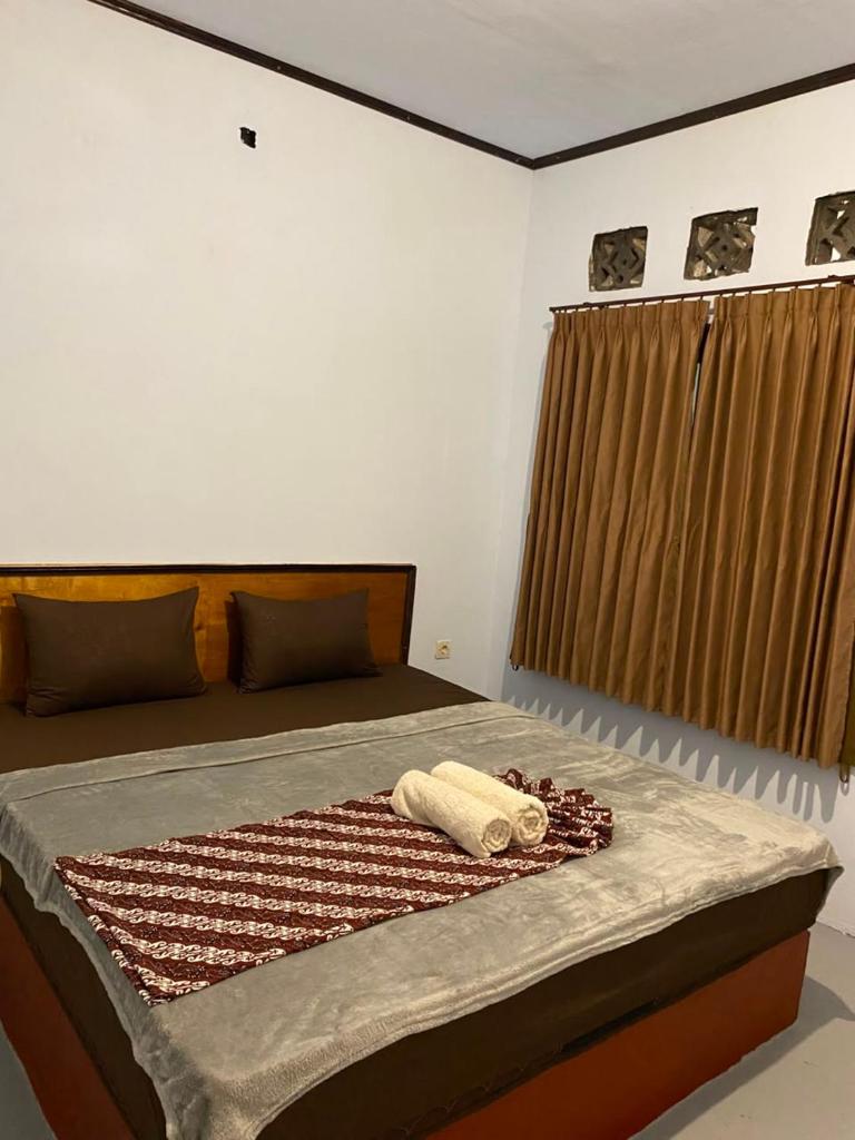 Palm Homestay Kuta - Tap to explore photos