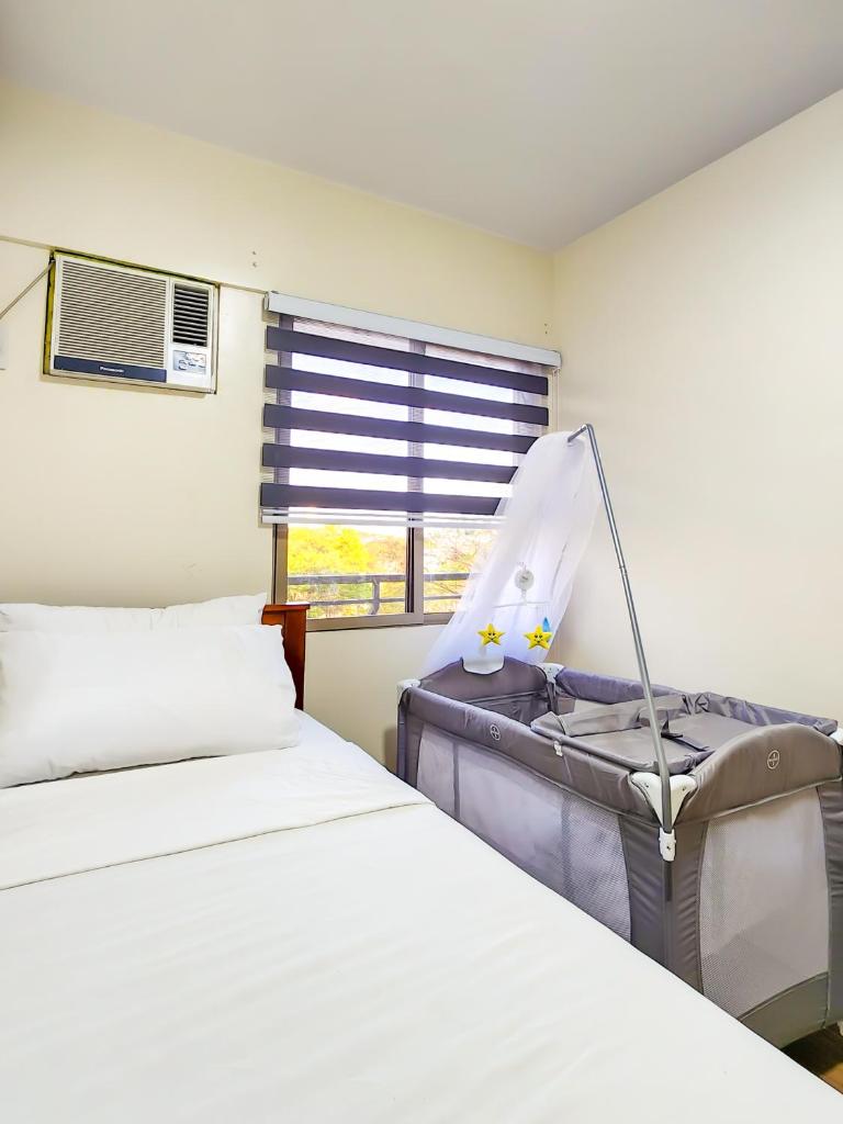 2BR Fully Air-Conditioned Staycation with Parking - Tap to explore photos
