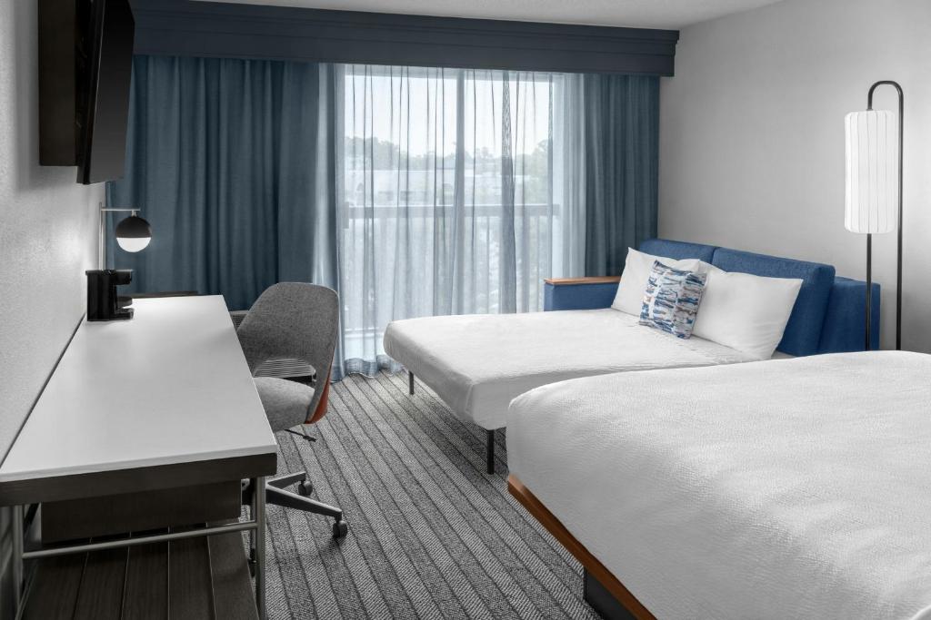 Courtyard Flint by Marriott - Tap to explore photos