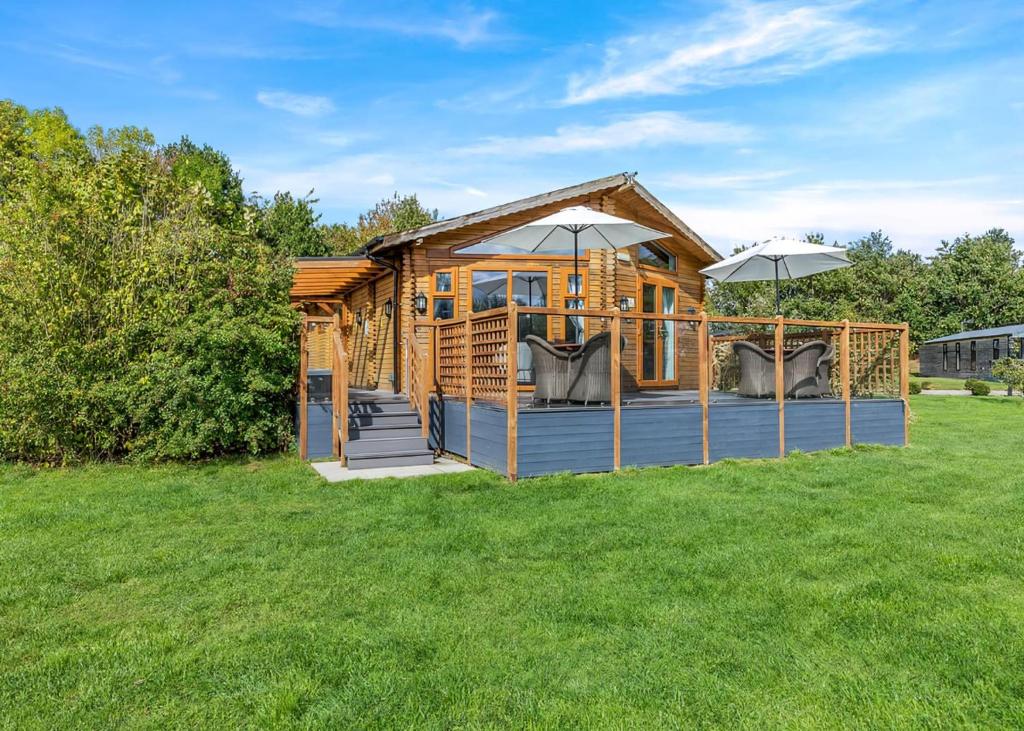 Gadlas Park Holiday Cabins - Tap to explore photos