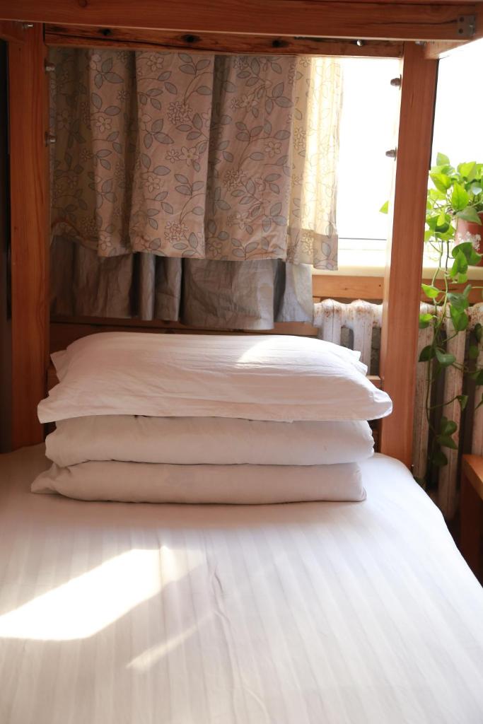 Номер (Кровать в общем номере с 4 кроватями и общей ванной комнатой), Harbin North International Youth Hostel