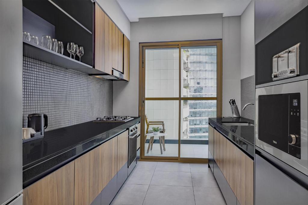 DoubleTree by Hilton Dubai M square Hotel & Residences Room Type - Ambassador Apartment with View