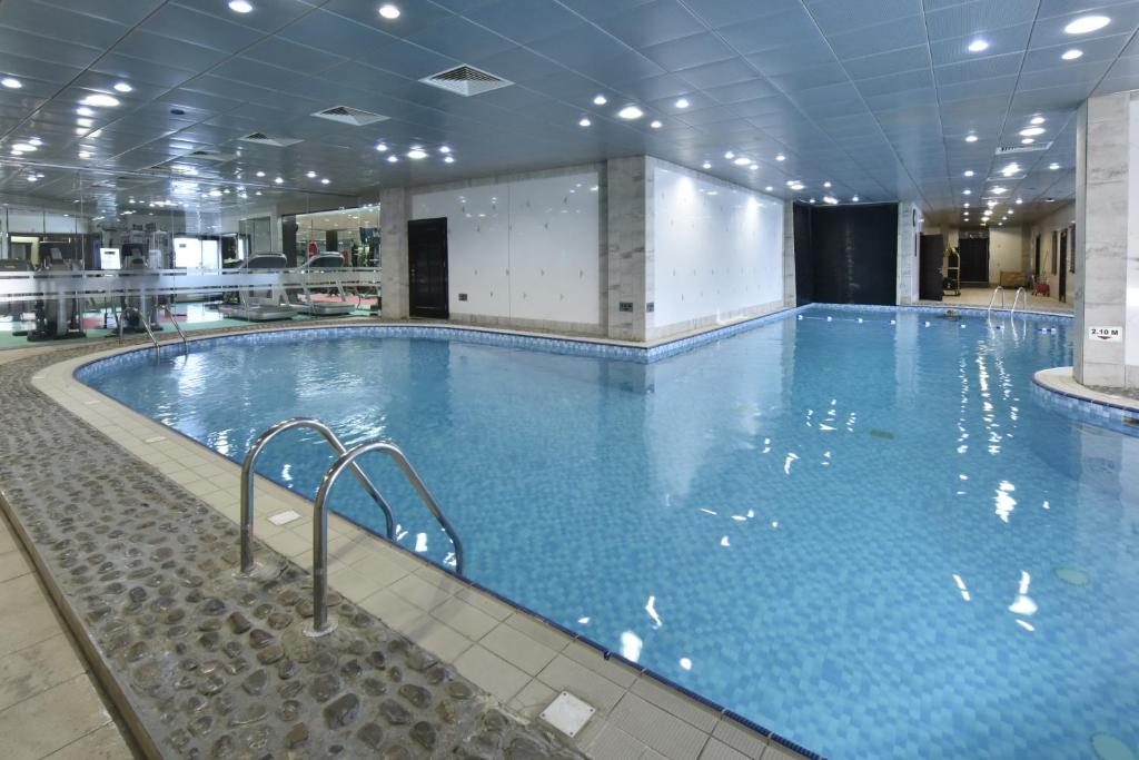 Awaliv International Hotel - Tap to explore photos