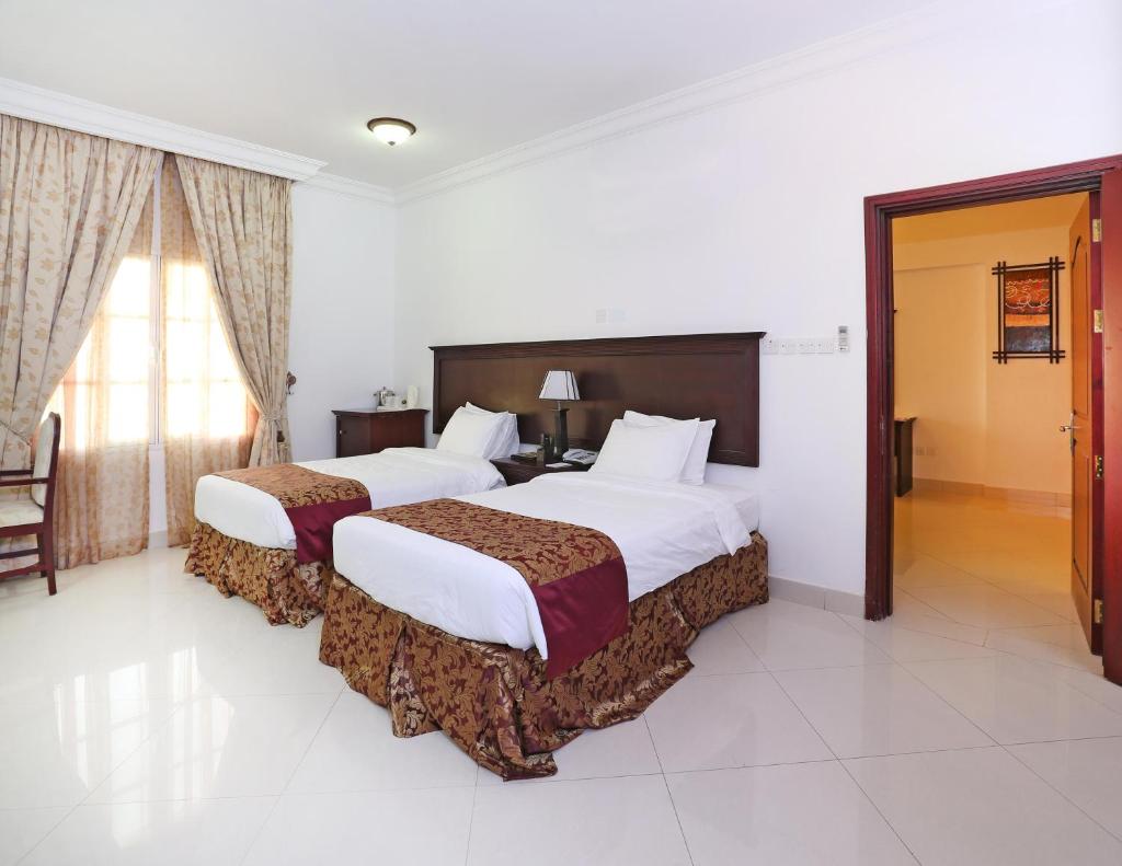 Двухместный (Двухместный номер Делюкс с 2 отдельными кроватями), Al Maha International Hotel