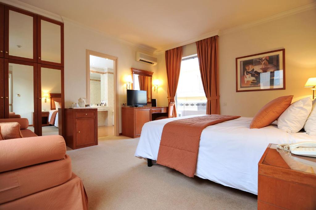 Athens Atrium Hotel and Suites - Tap to explore photos