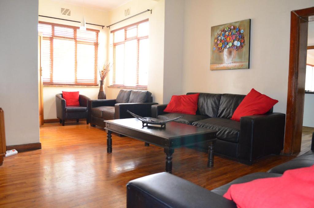 Shared lounge/TV area, A Sunflower Stop Backpackers in Cape Town