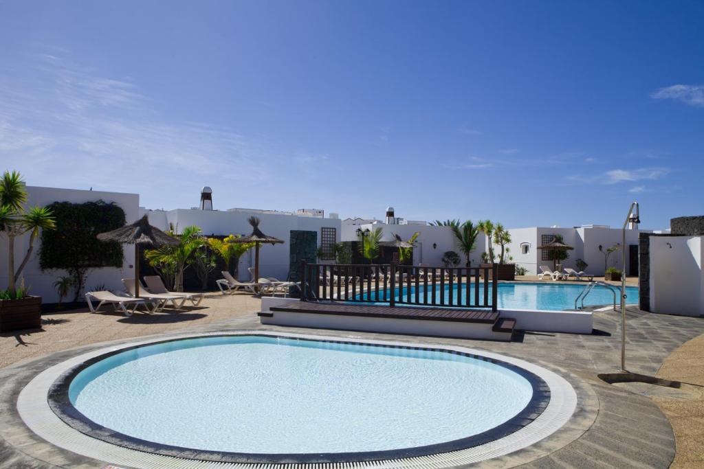 Apartamentos LIVVO Coloradamar — Swimming pool in Playa Blanca, Canary Islands